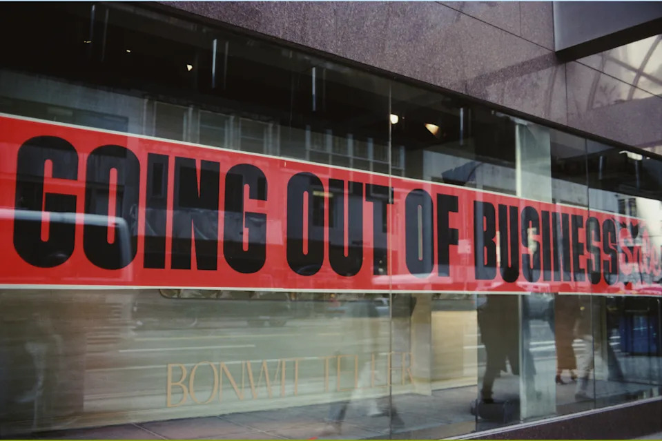 A ‘Going Out Of Business’ sign in the window of the Bonwit Teller department store in New York City, USA, in 1990. | Getty Images