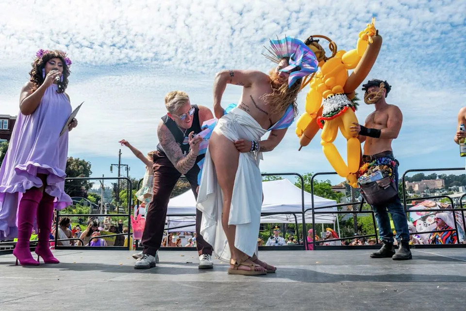 Trans Jesus gets a hormone therapy injection onstage at the Hunky Jesus contest at Dolores Park in San Francisco on April 5. (Camille Cohen/For the S.F. Chronicle)