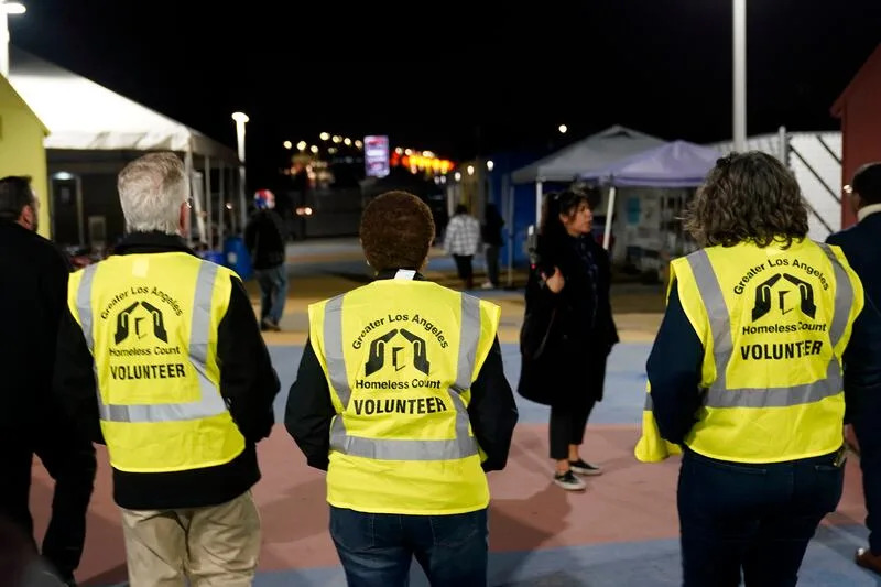From left to right, City councilman Paul Krekorian, left, Mayor Karen Bass, and LA Family Housing CEO Stephanie Klasky-Gamer participate in the city's annual homeless count in the North Hollywood section of Los Angeles Tuesday, Jan. 24, 2023. Thousands of clipboard-toting volunteers with the LA Homeless Services Authority fanned out across the county Tuesday night for the effort's main component, the unsheltered street tally. | Marcio Jose Sanchez, Associated Press