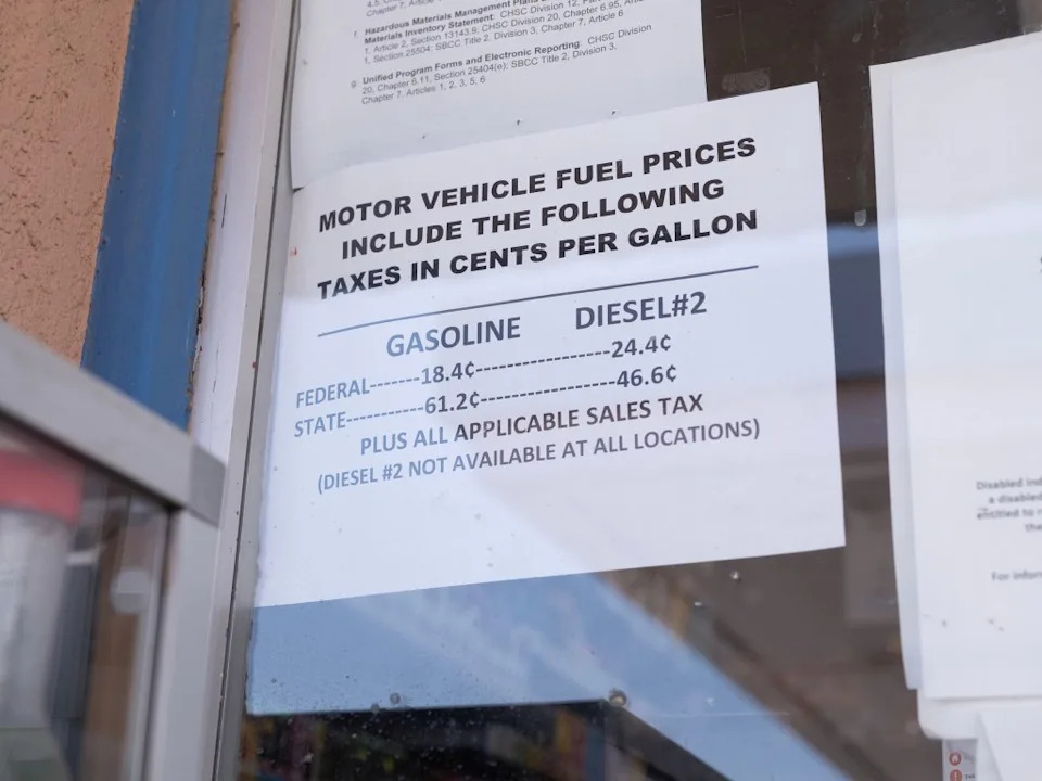 A sign detailing motor vehicle fuel taxes in cents per gallon for gasoline and diesel. Andy Johnstone for CA Post