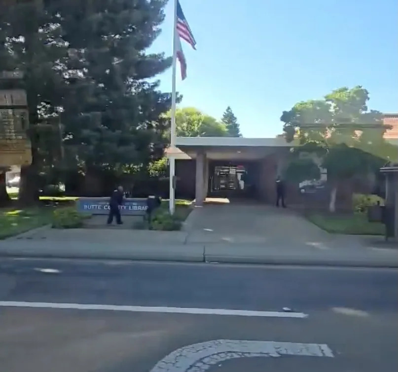 Cops are seen surrounding Butte County Library, where Sayer allegedly committed the shooting. Jeannie Schroeder