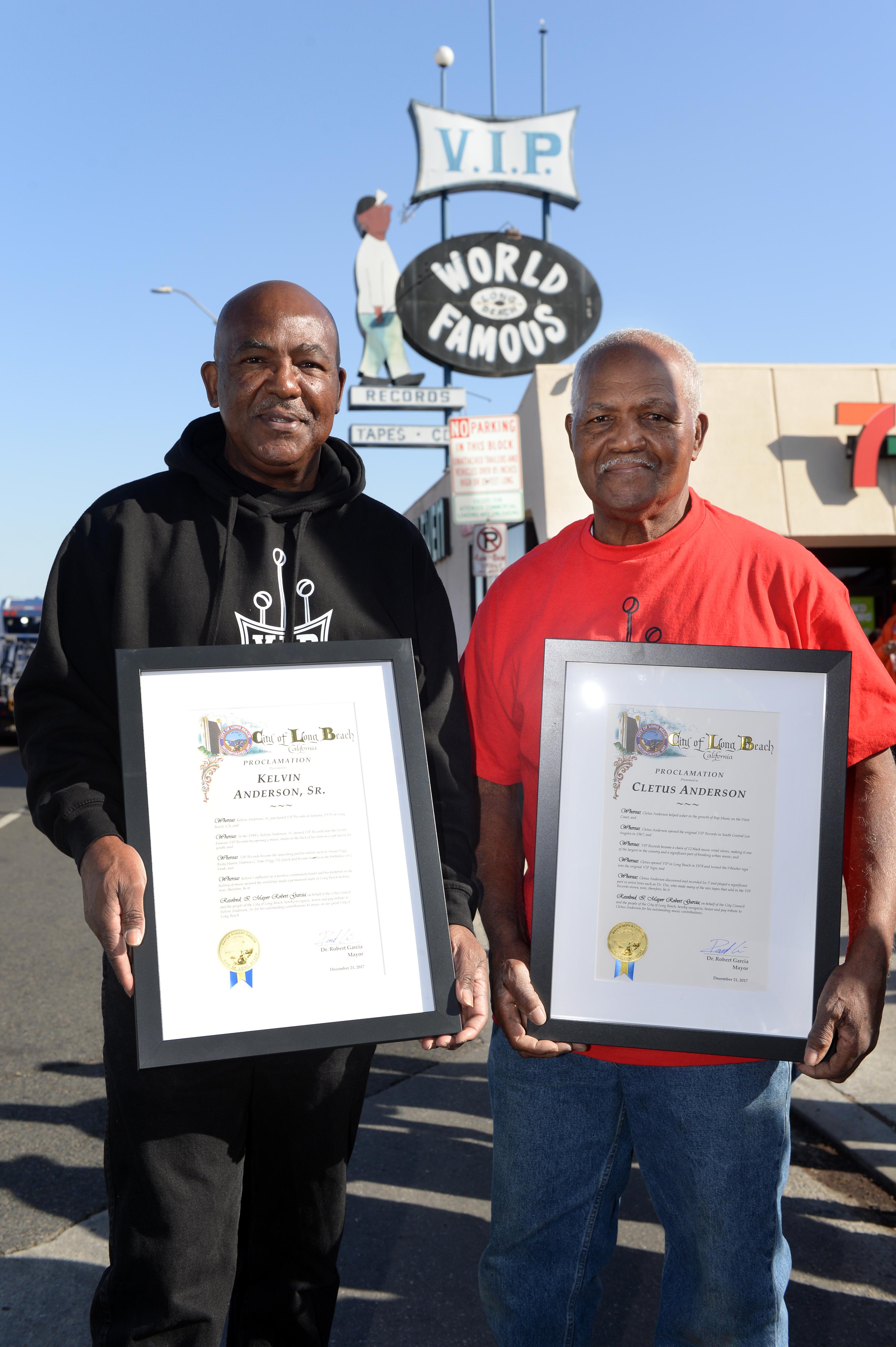 Mayor Robert Garcia is presented a proclamation to brothers Kelvin...