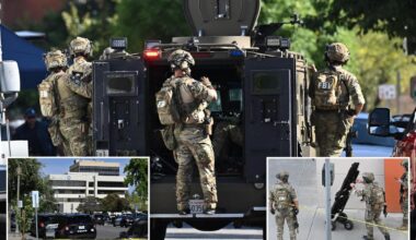 Bank robber 'with bombs strapped to him' still barricaded with hostages