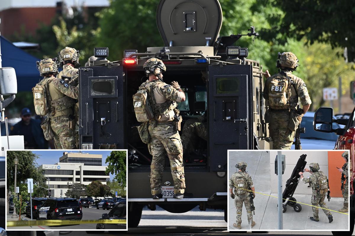 Bank robber 'with bombs strapped to him' still barricaded with hostages