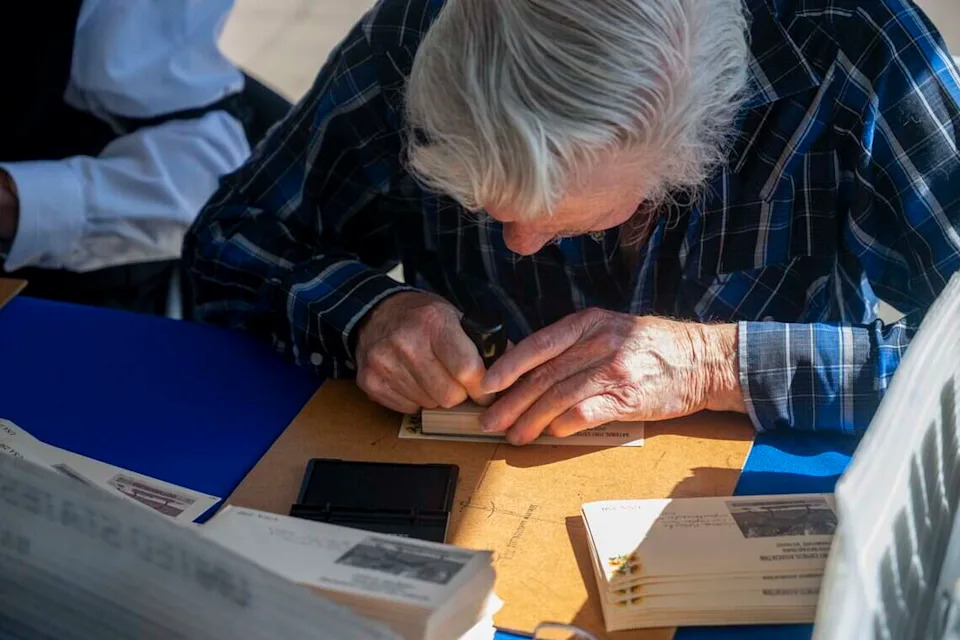 After arriving by horseback during the National Pony Express Association’s re-ride across the United States on Thursday, June 25, 2026, mail is stamped in Old Sacramento.