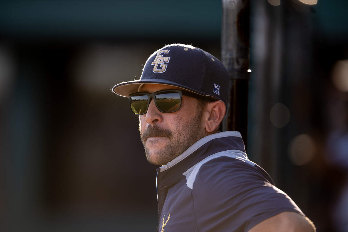 Elk Grove Thundering Herd coach Joe Bellotti watches from the dugout against the Rodriguez Mustangs on May 20 in the CIF Sac-Joaquin Section Division II baseball championship at Sacramento City College.