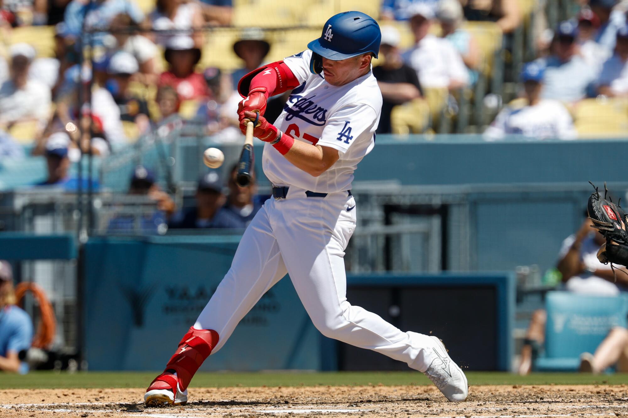 Ryan Ward hits a solo home run for the Dodgers in the fourth inning Sunday against the Phillies.