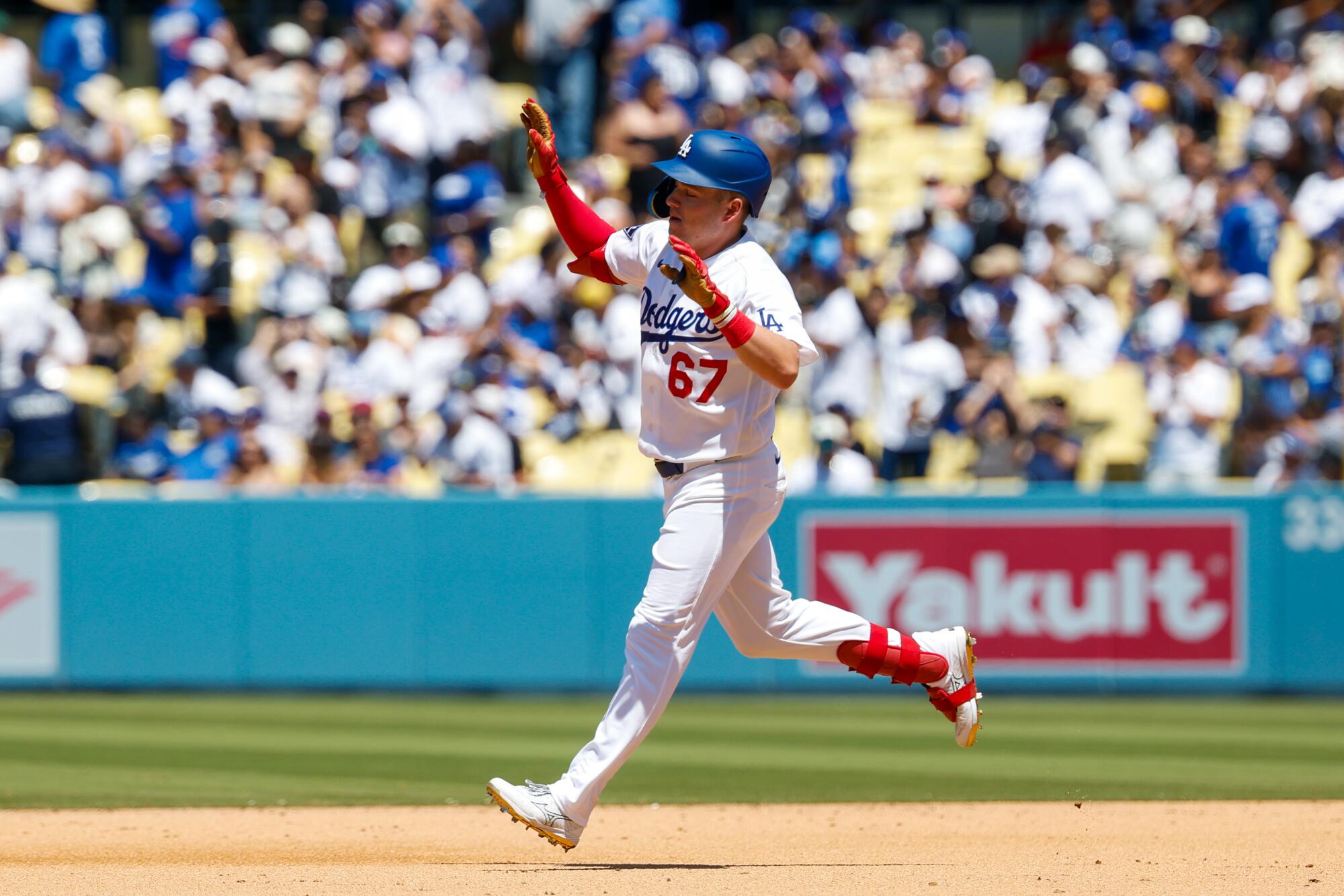 Ryan Ward celebrates as he runs the bases after hitting a home run in the fourth inning Sunday against the Phillies.
