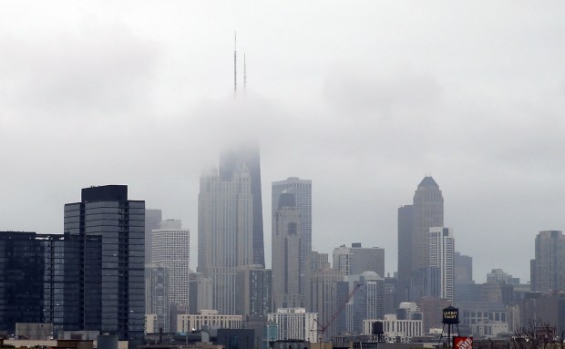 Fog covers the Chicago Skyline on Friday, April 29, 2016.