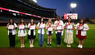 The eight recipients of the 2026 Angels Scholar awards pose for a photo at Angel Stadium. Each student received a $10,000 college scholarship through the Angels Baseball Foundation.