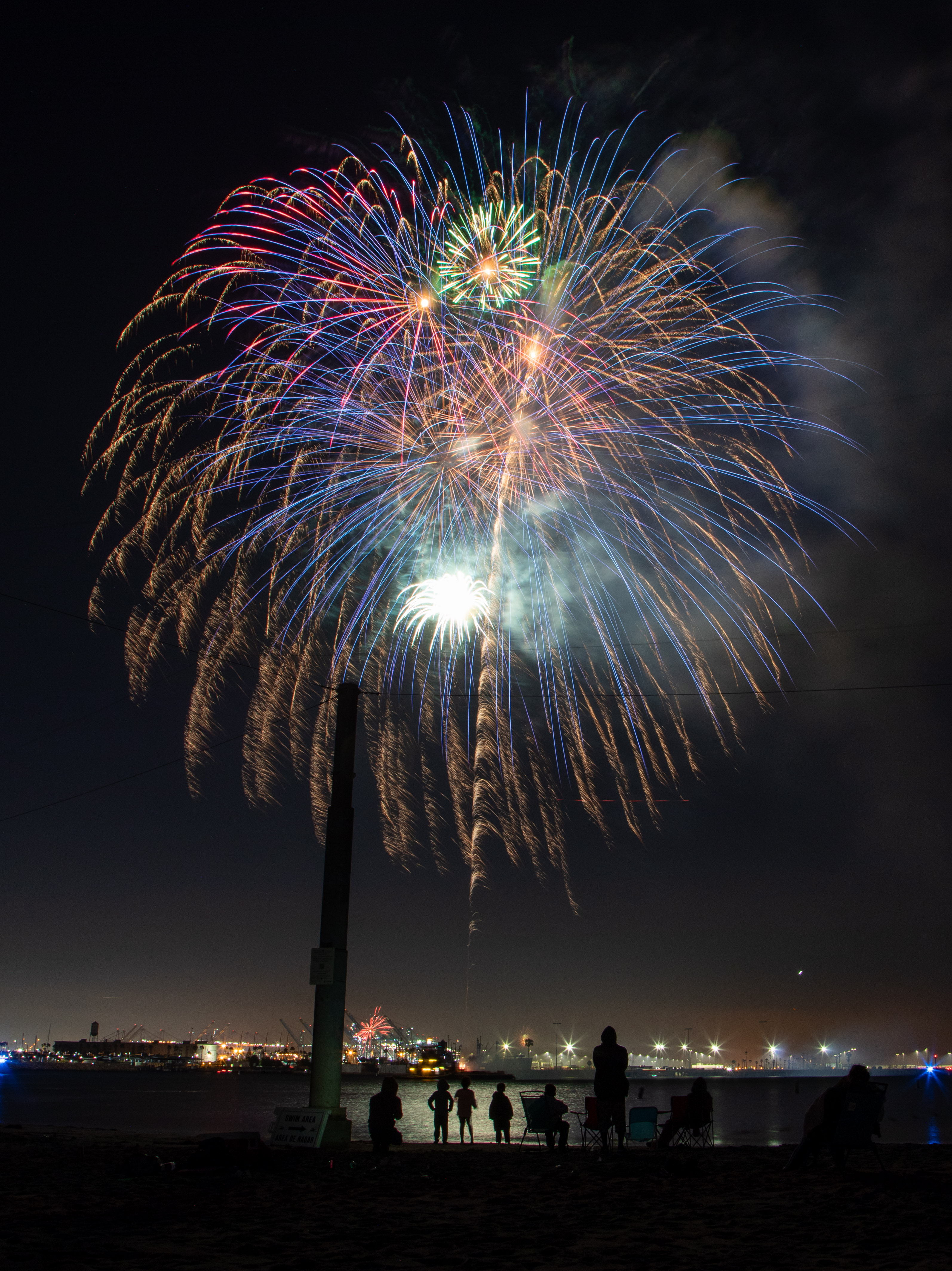 Fireworks were shot off a barge in the harbor at...