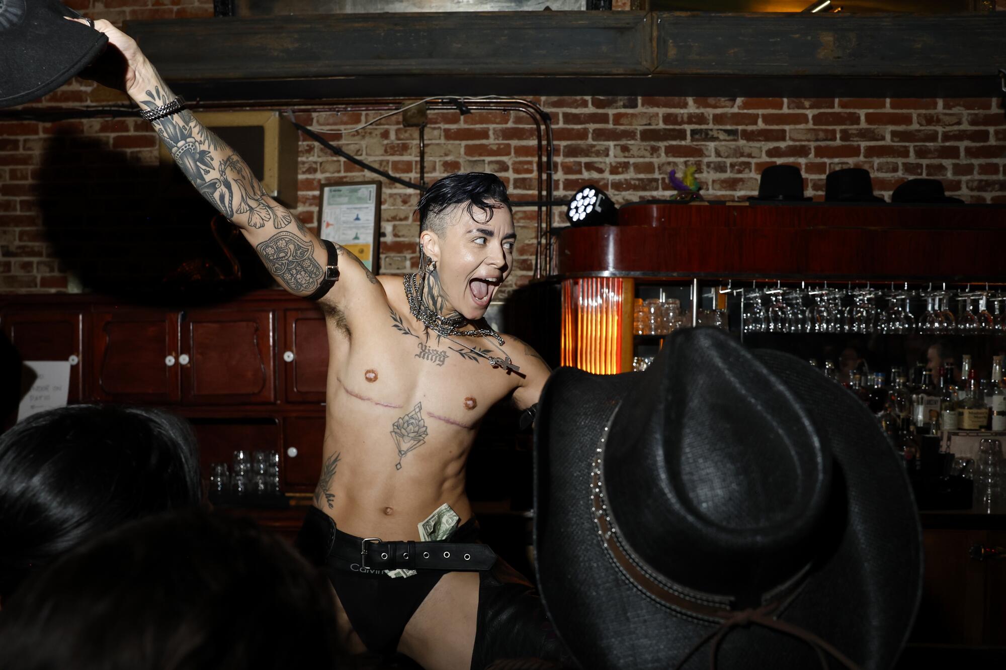 King Captain gets their underwear stuffed with dollar bills from the crowd.