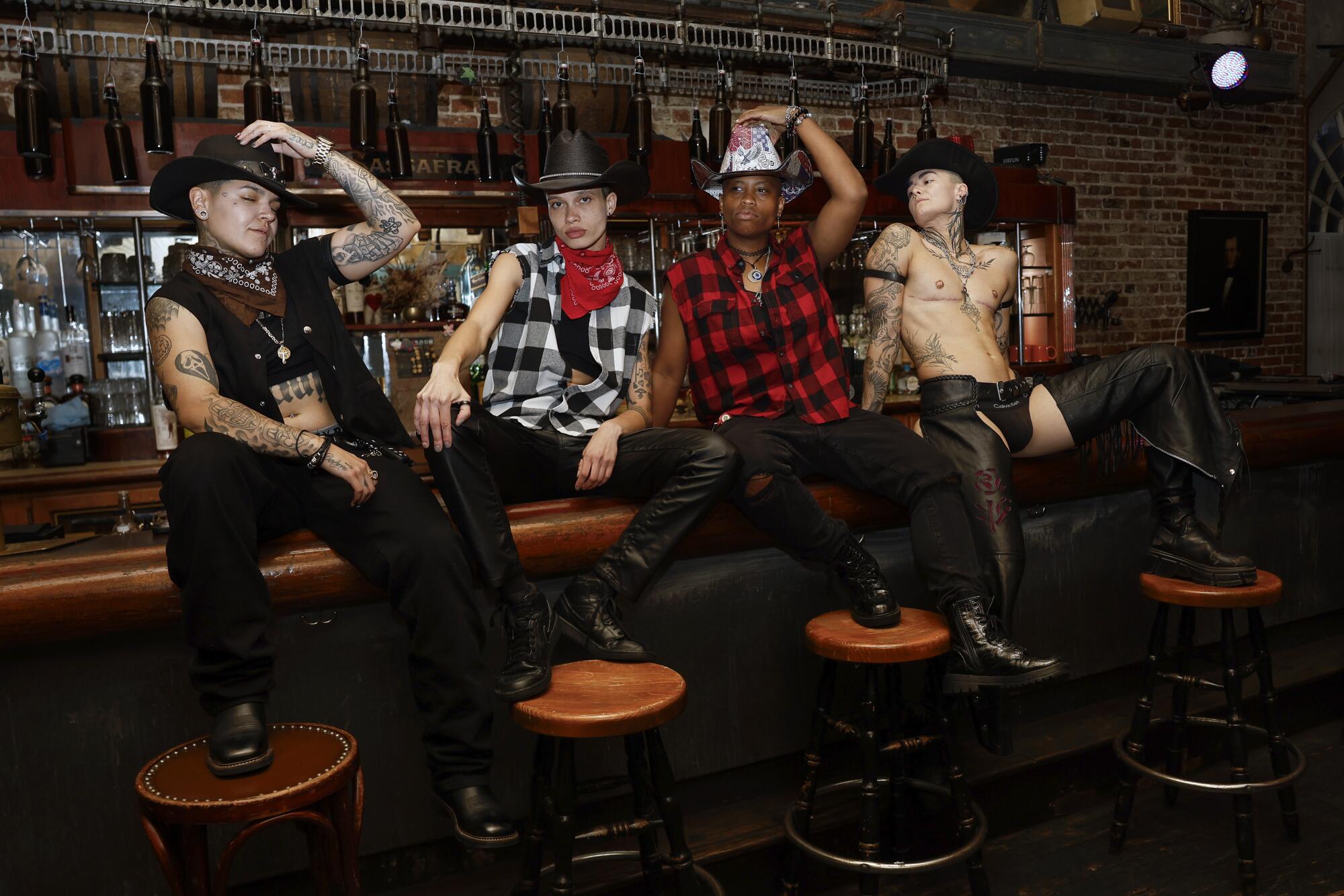 Members of Magic Mascs pose for a portrait at the Sassafras Saloon in Hollywood.