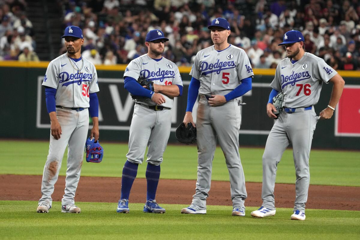 Mookie Betts, from left, Max Muncy, Freddie Freeman and Alex Freeland await the pitcher.