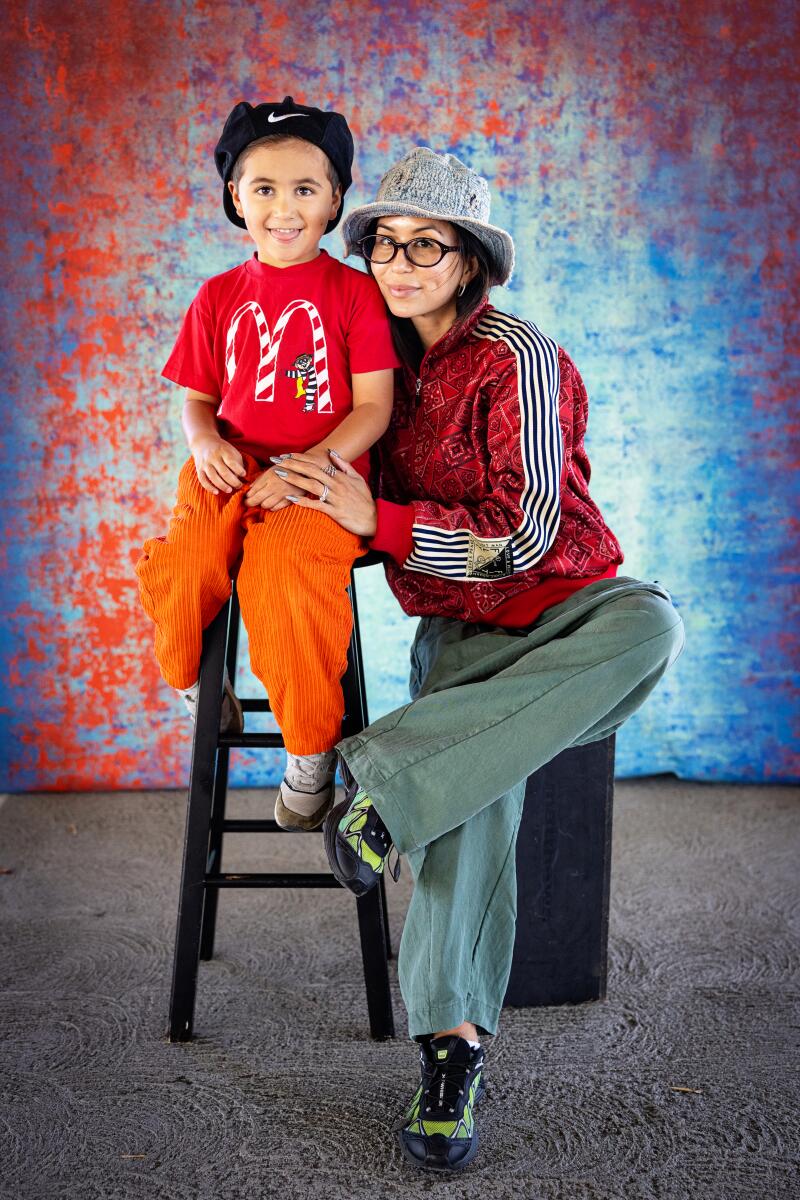 A child and mom seated.