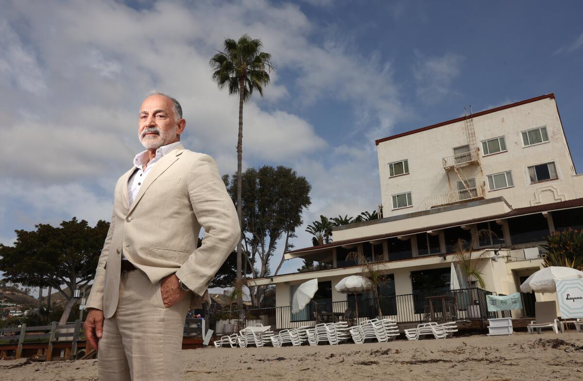 Mohammad Honarkar is photographed on the sand behind Hotel Laguna.
