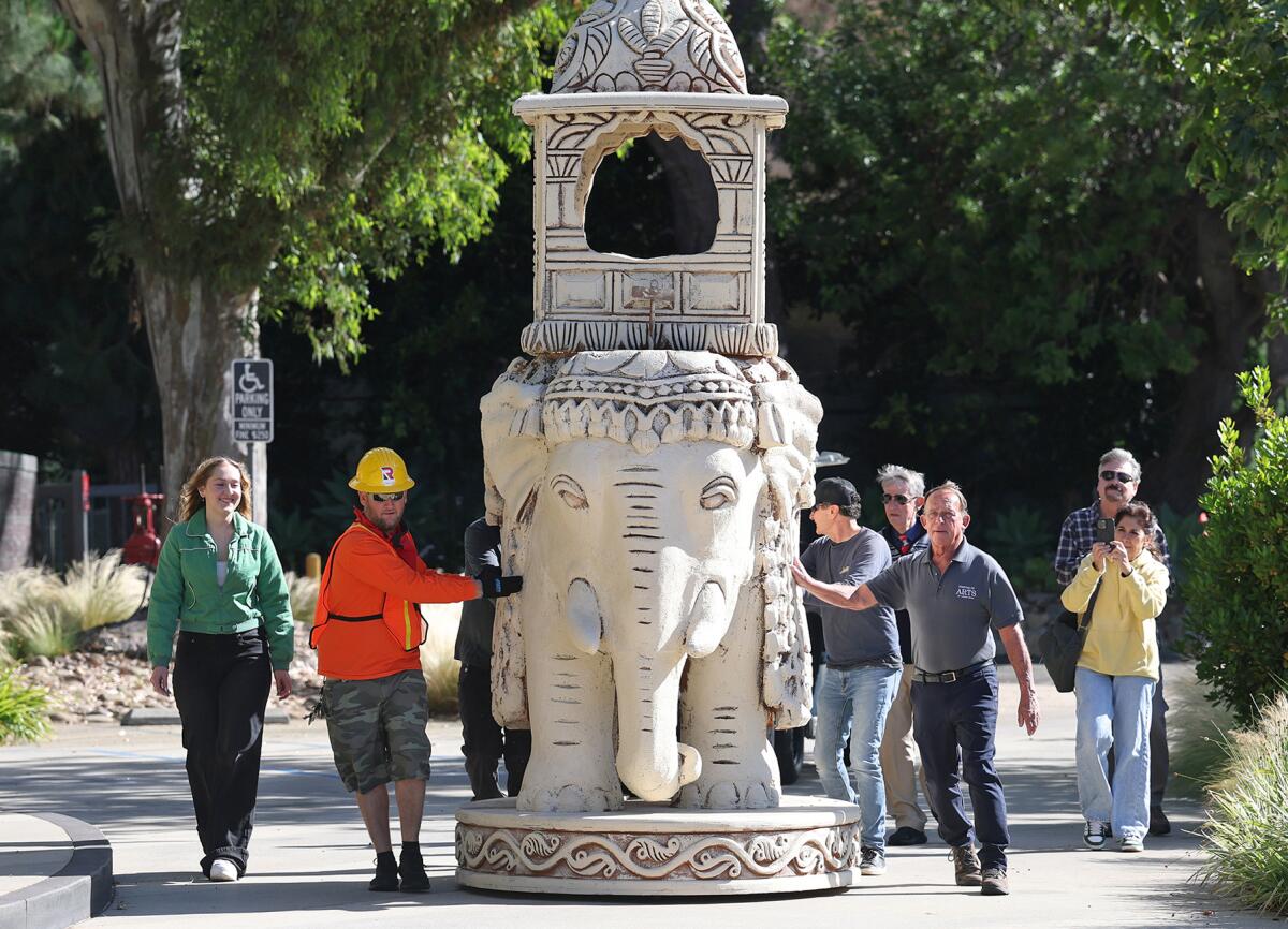 An oversized King chess sculpture, from the Pageant of the Master's "Indian Chess Set" is wheeled in a procession.