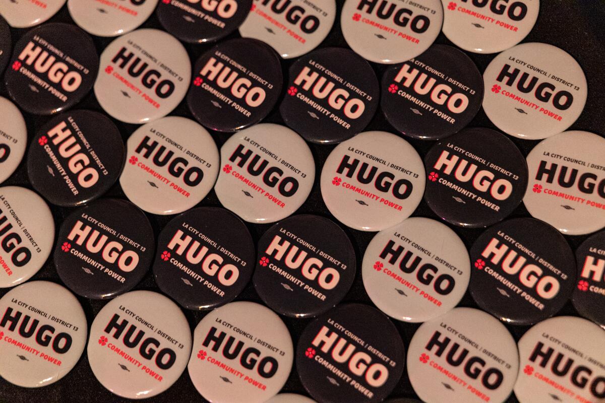 A table filled with campaign buttons for Hugo Soto-Martinez.