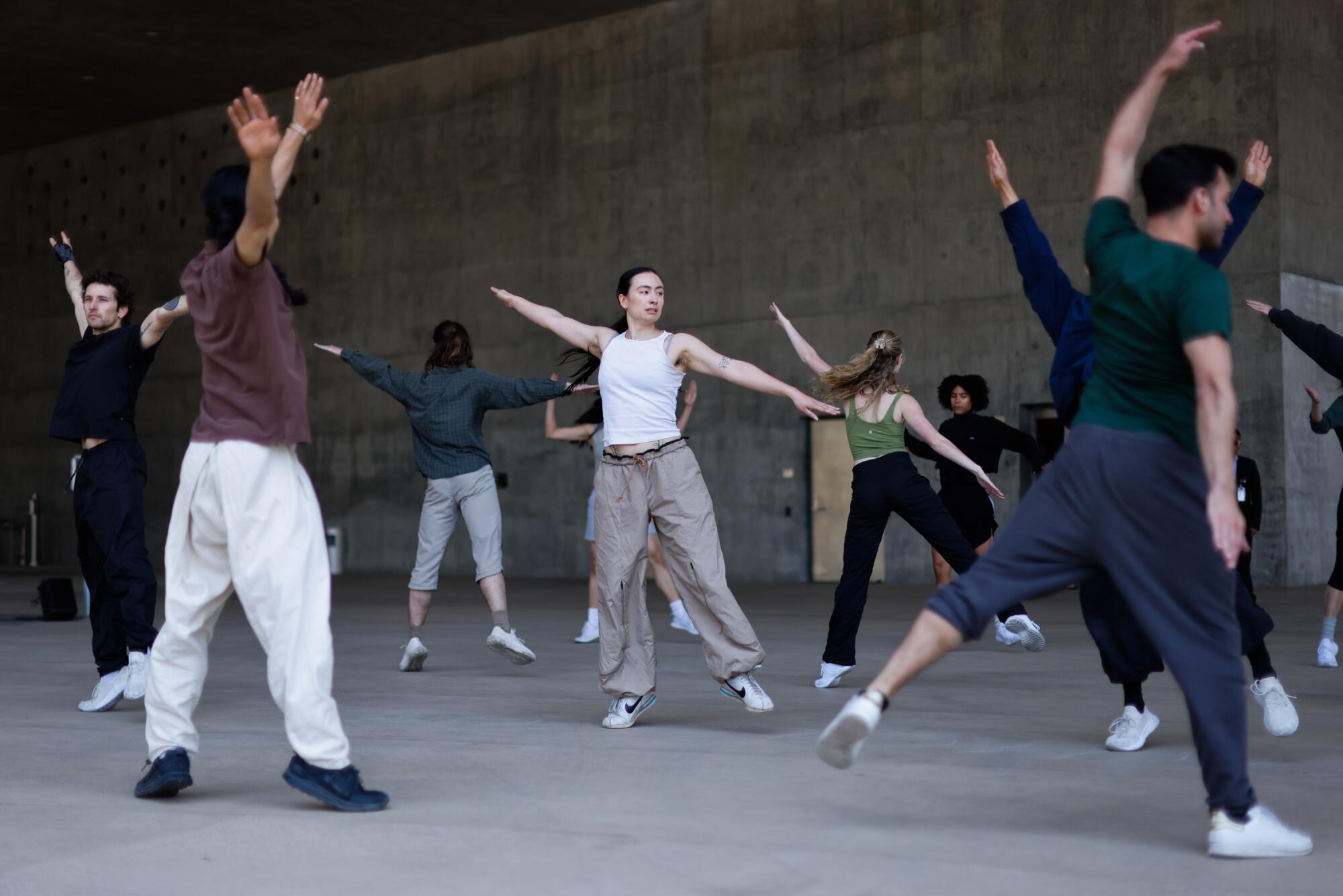 Dancers rehearsing outdoors.