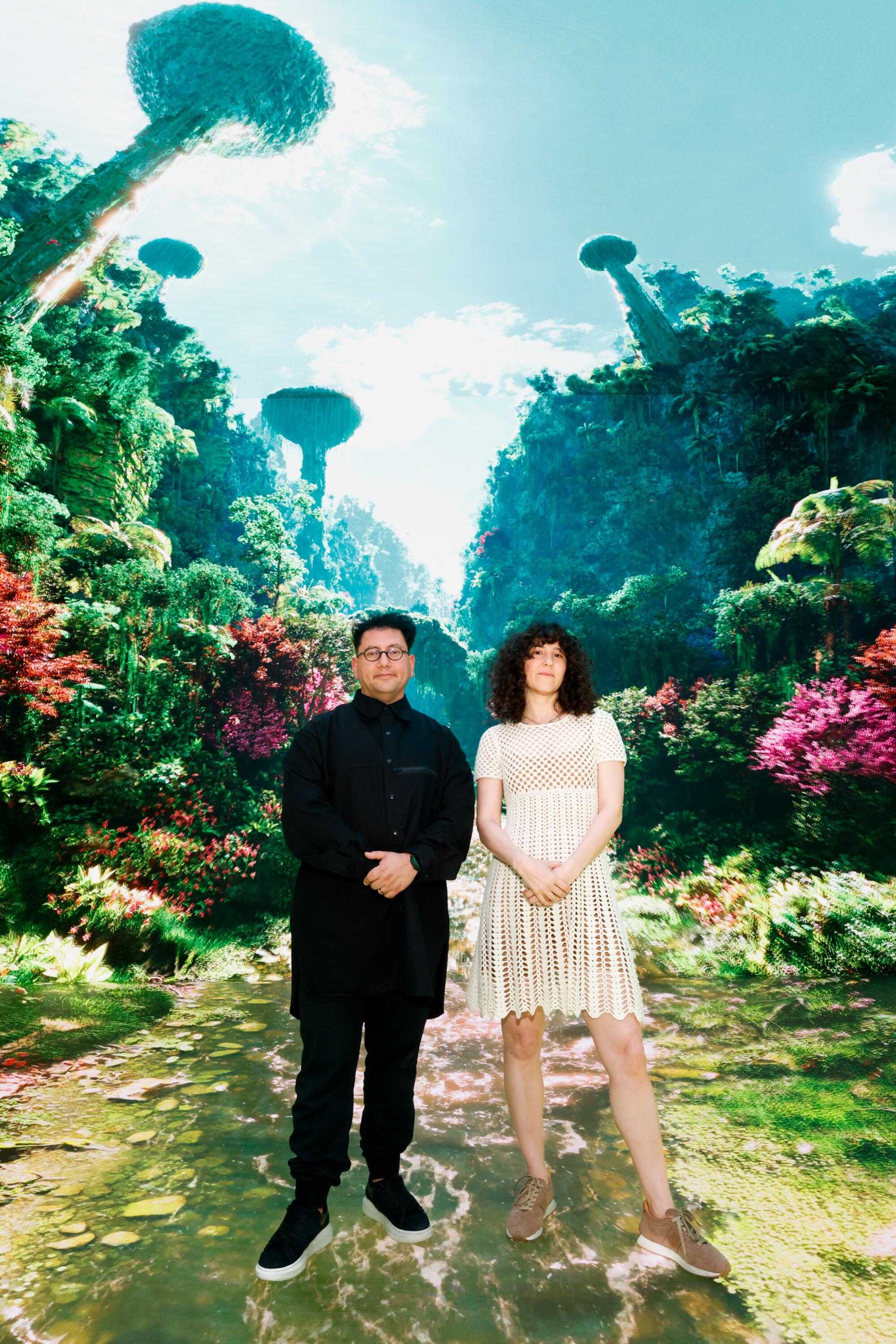 Two people stand in a gallery filled with immersive AI art.