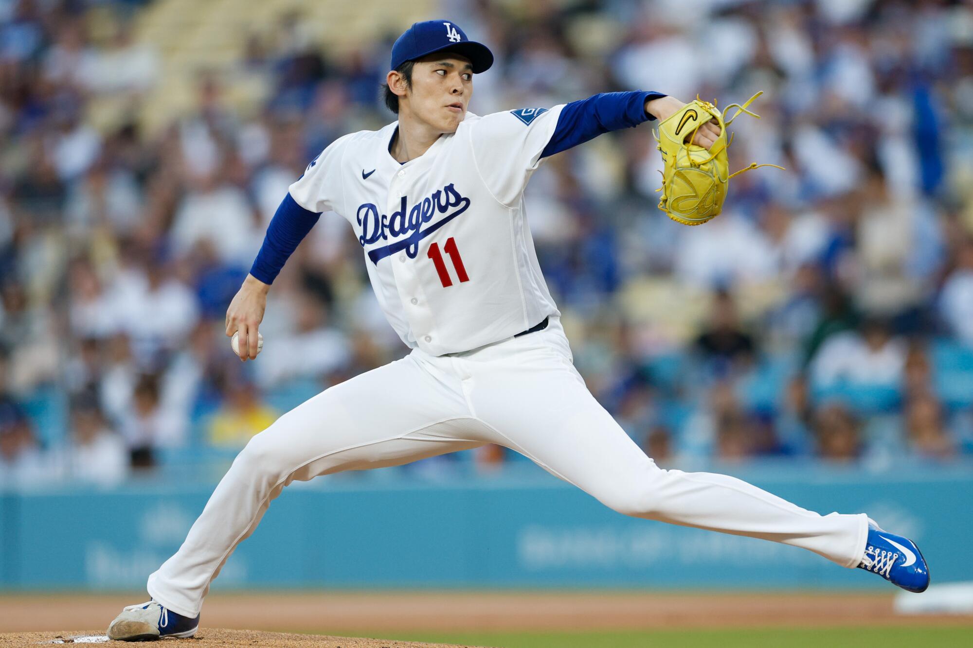 Dodgers pitcher Roki Sasaki throws from the mound during a game against the Giants on May 11.