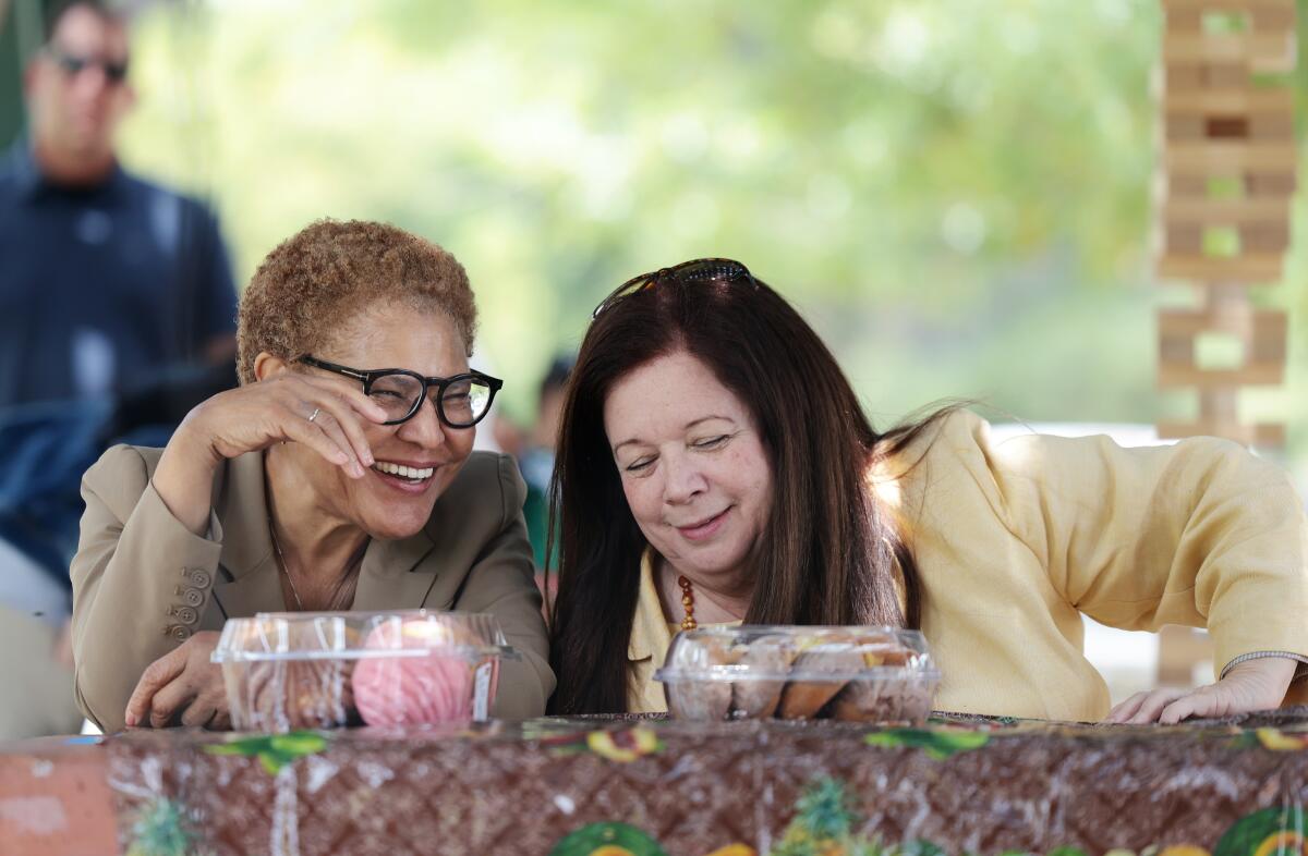Karen Bass, left, shares a laugh with Hydee Feldstein Soto