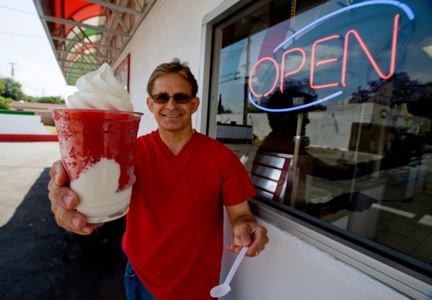 Joe's Italian Ice owner Mike Abeyta shows off the signature Joe Latti treat in 2013. (Photo by Jebb Harris, Orange County Register/SCNG)