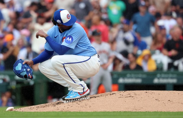 Chicago Cubs starting pitcher Edward Cabrera crouches down on the pitchers mound after giving up a grand slam to San Francisco Giants third baseman Matt Chapman in the fourth inning of a game at Wrigley Field in Chicago on June 5, 2026. (Chris Sweda/Chicago Tribune)