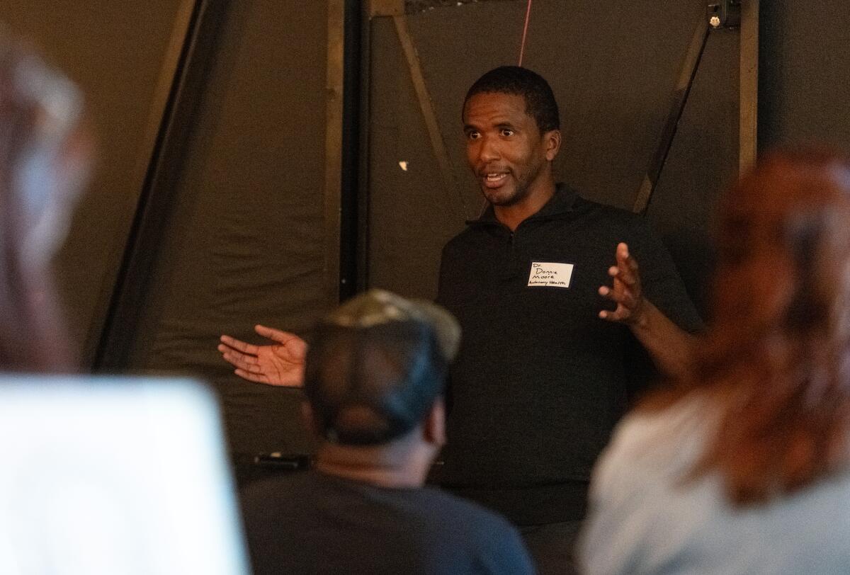 Dr. Donnie Moore of Autonomy Health address attendees of Death over Drafts at Honey River Brewing in Anaheim on Thursday.