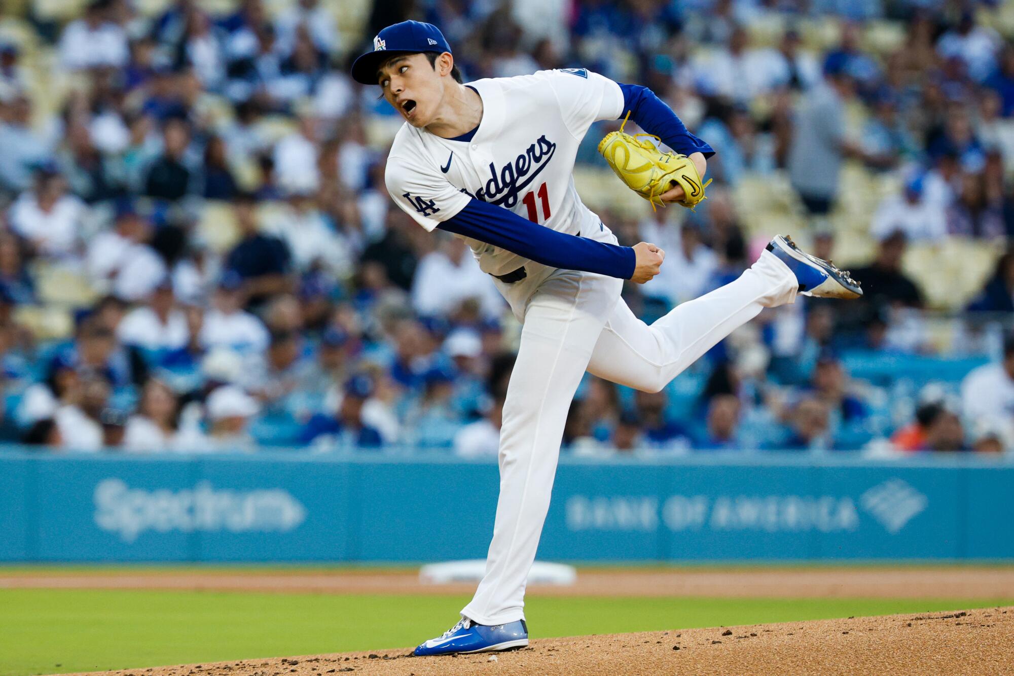 Dodgers pitcher Roki Sasaki delivers in the first inning of a 1-0 win over the Angels at Dodger Stadium on Friday night.