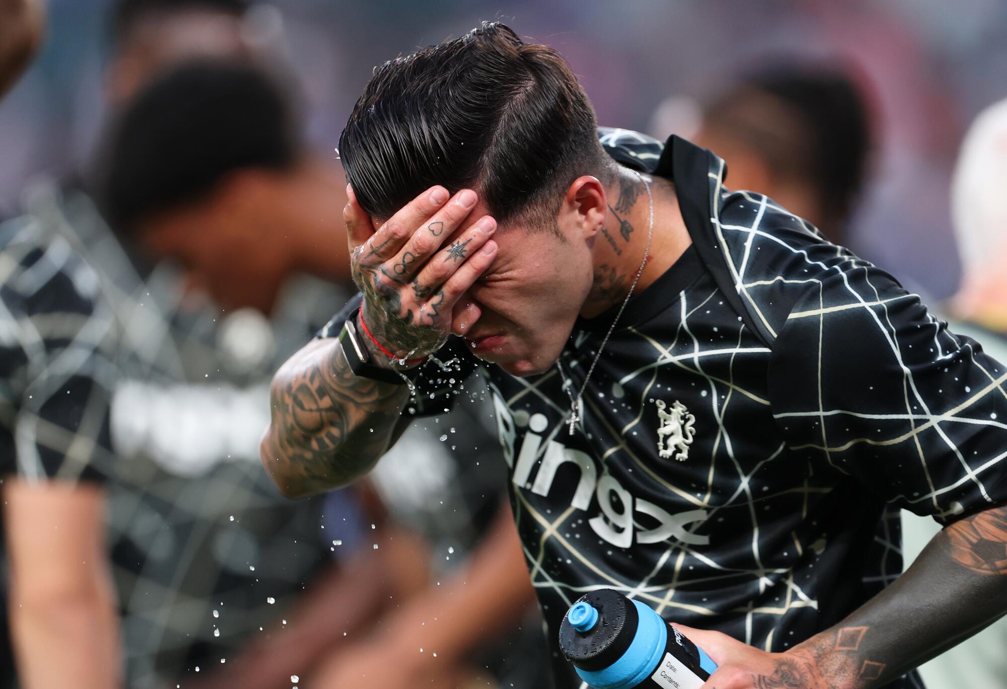 Chelsea's Benoit Badiashile puts water on his face before at Club World Cup match against Esperance de Tunis.