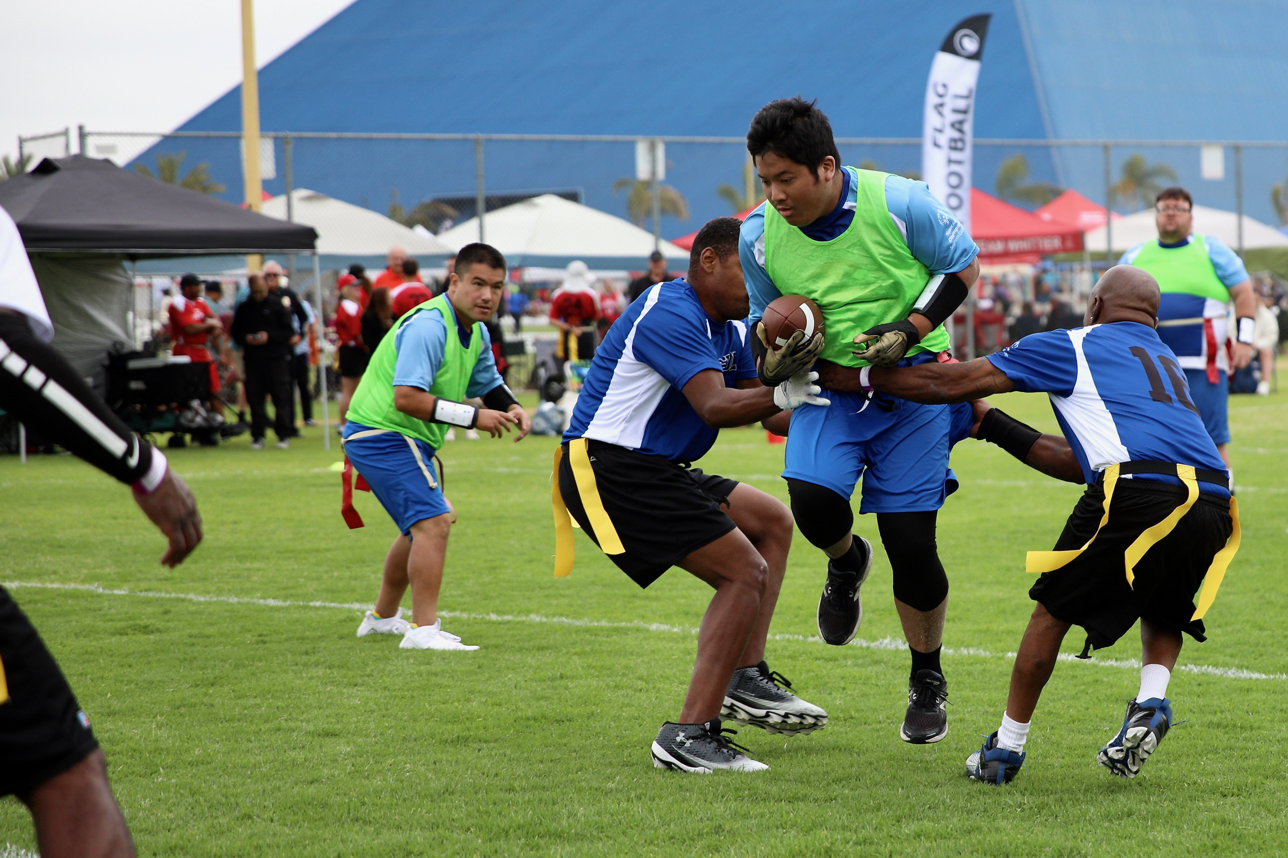 A Laguna Hills Hawks running back is tackled by a...