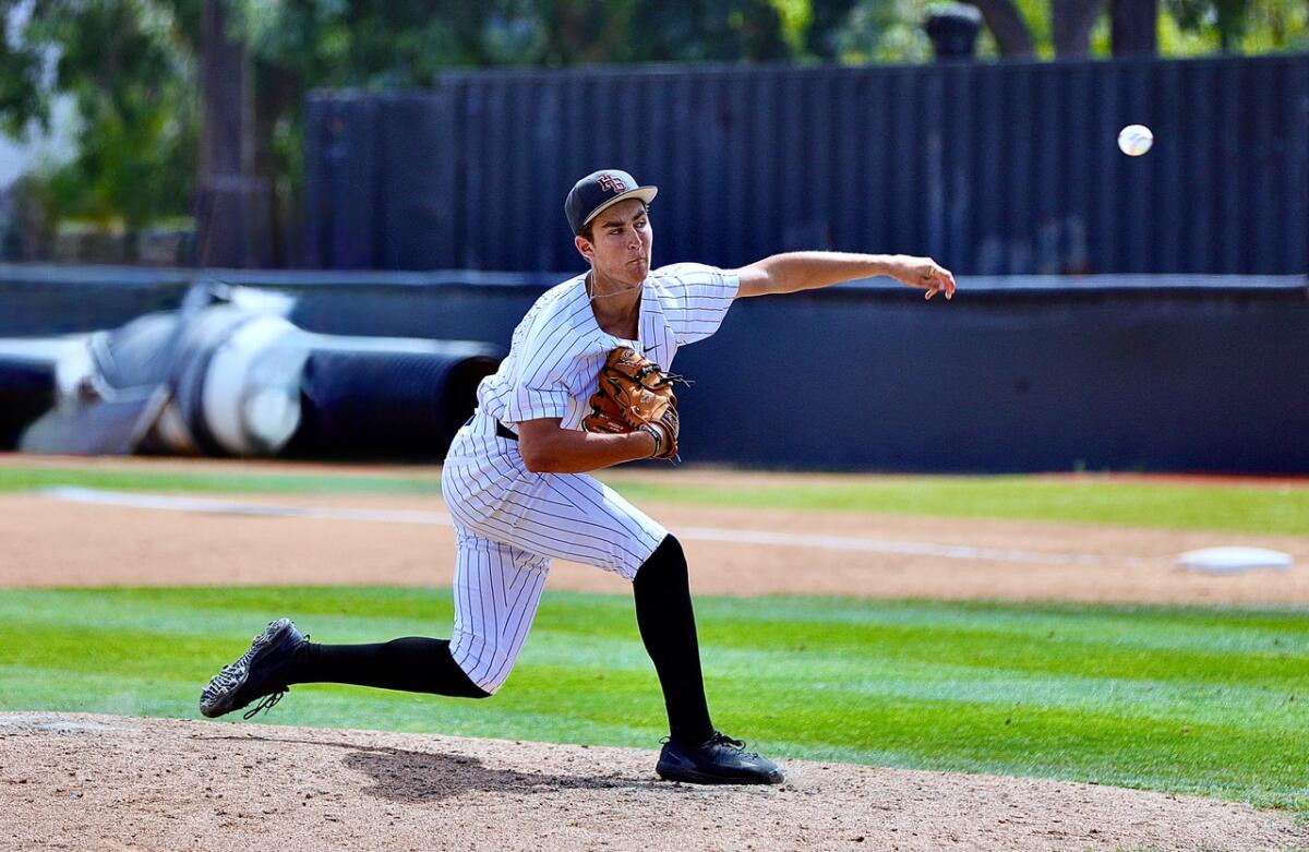 Huntington Beach pitcher Jared Grindlinger delivers against San Diego Cathedral Catholic.