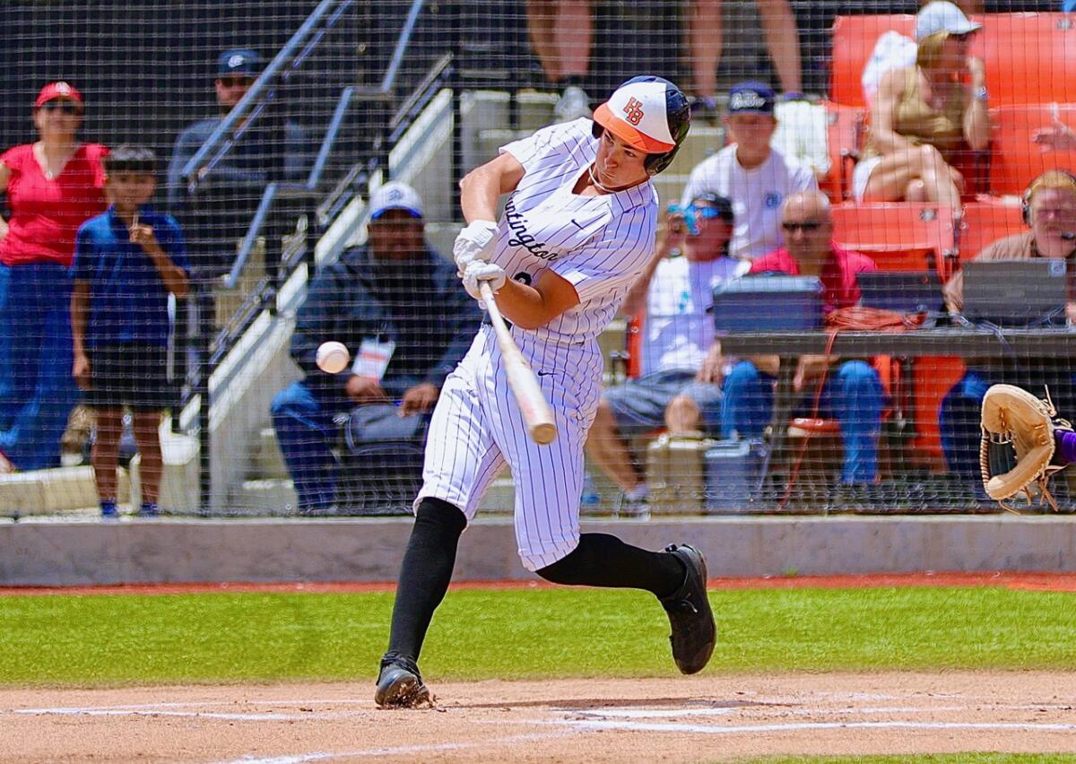 Huntington Beach pitcher Jared Grindlinger hits a two-run home run in the first inning.