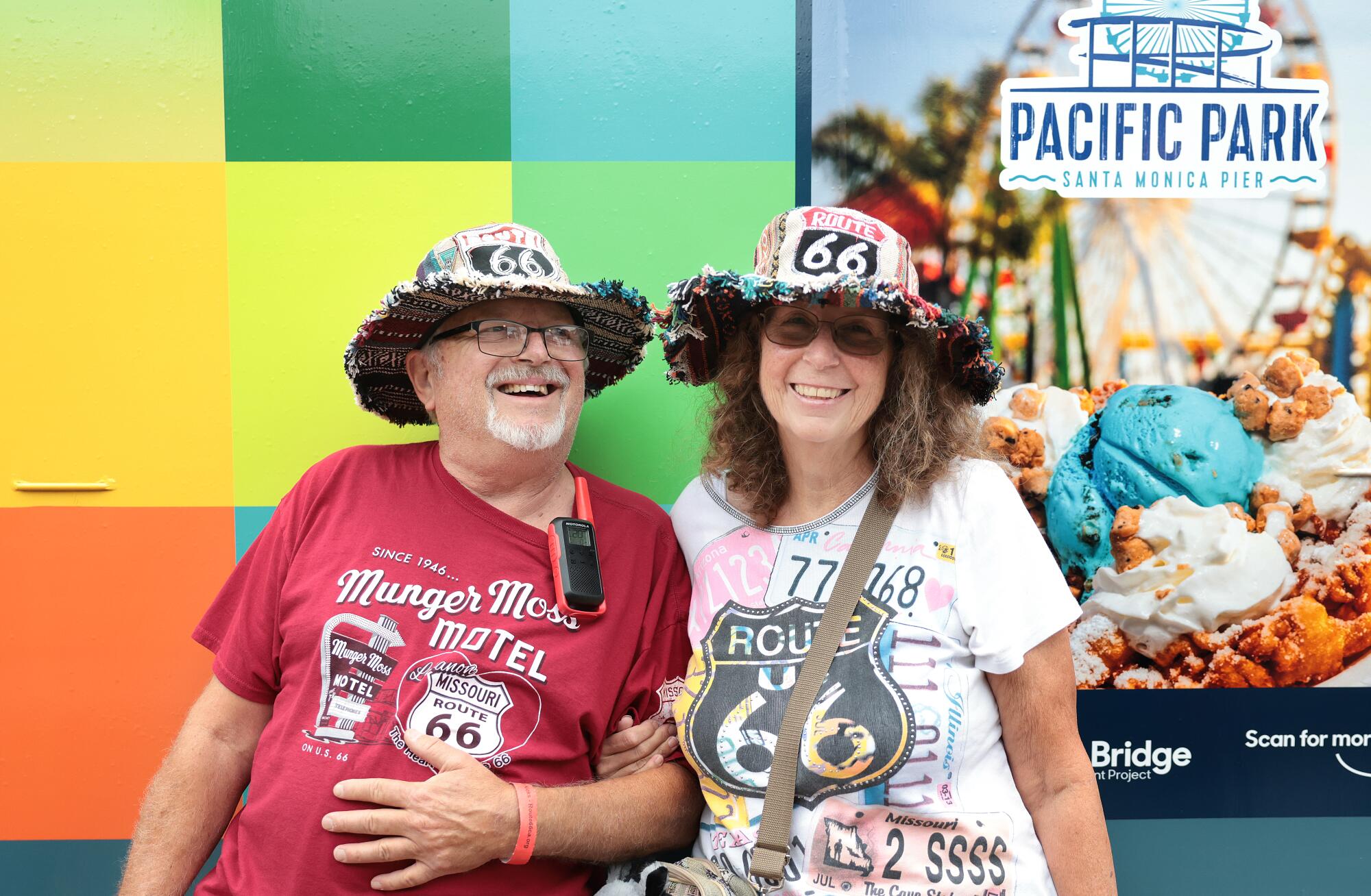 Mike and Lisa Visket of Prescott, Ariz., at the Santa Monica Pier in their respective orange and white Route 66 shirts