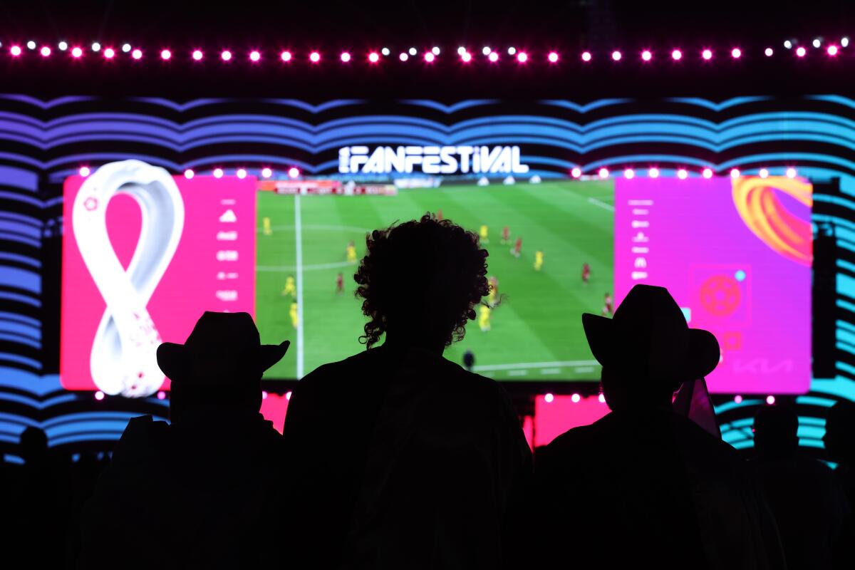 Fans watch the opening match between Qatar and Ecuador at fan festival during the 2022 World Cup in Doha, Qatar.