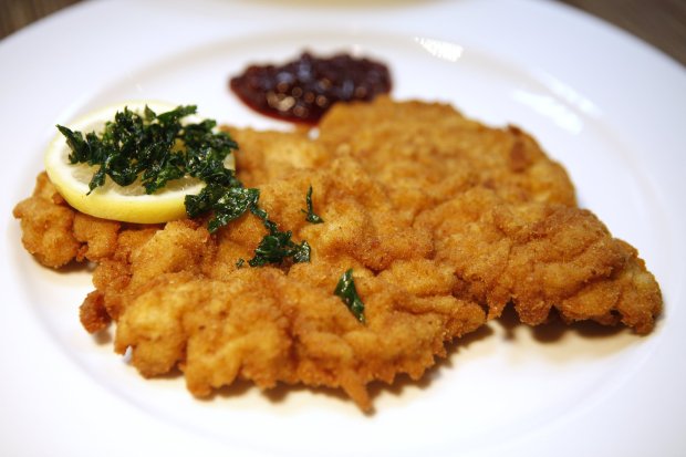 Wiener schnitzel served with potato salad at Naschmarkt Restaurant in Campbell, Calif. on Thursday, December 1, 2011. (Josie Lepe/Mercury News Staff)
