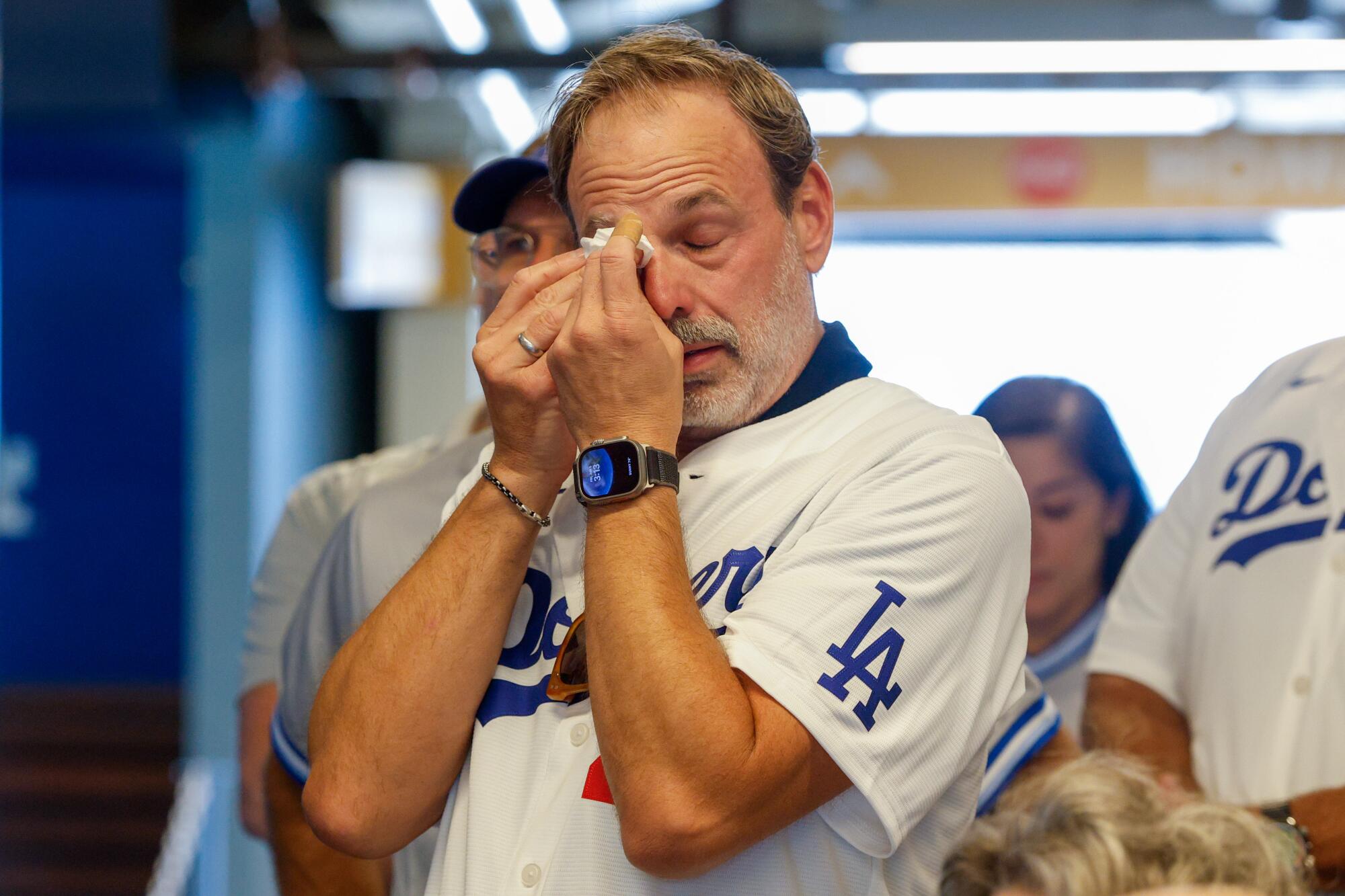 Greg Baker, husband of the late Billy Bean, wipes away tears during a tribute honor Bean as a LGBTQ+ pioneer.