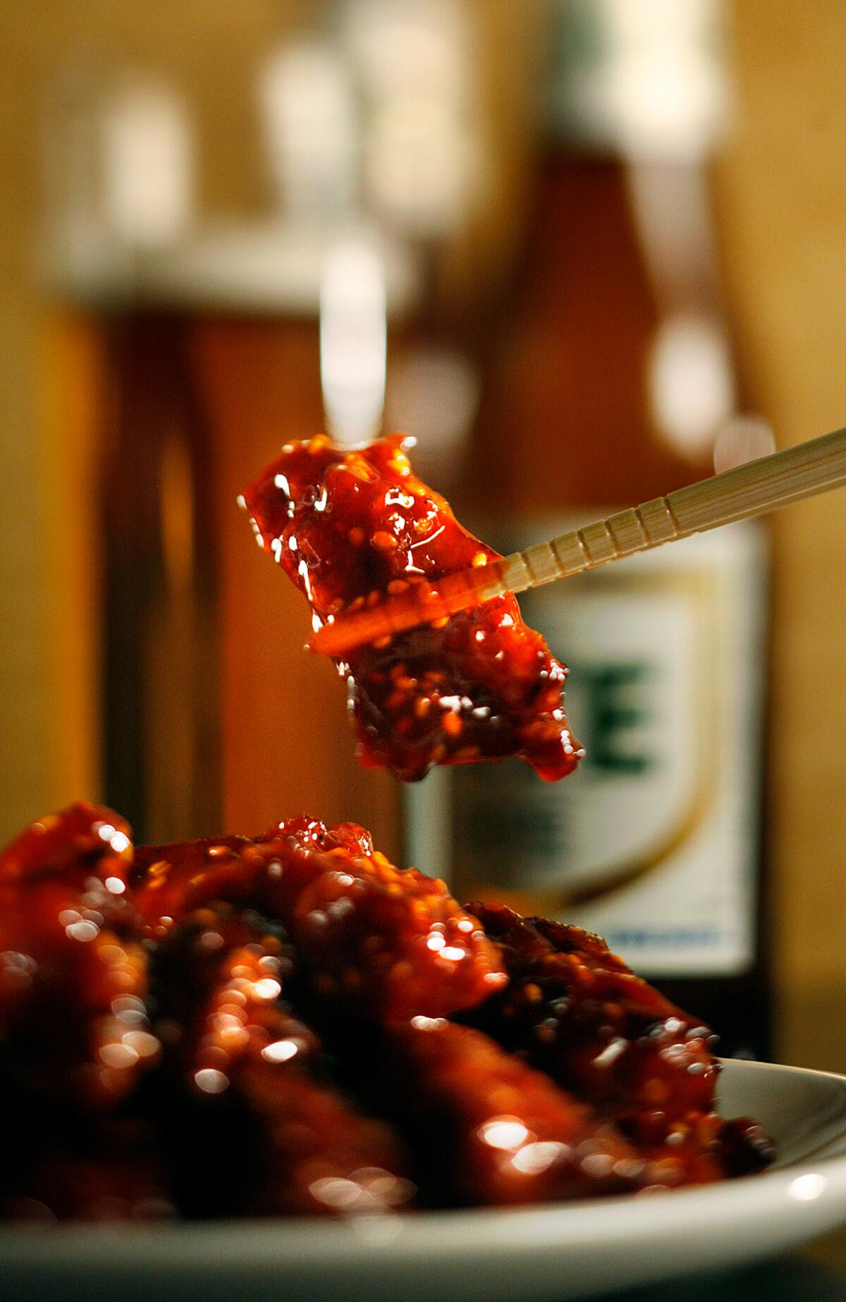 Yangnyeom dak (Korean fried chicken) is twice-fried and coated in gochujang sauce.