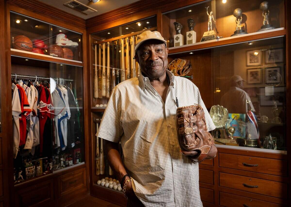 Dusty Baker wears the baseball glove he used during his playing career with the Los Angeles Dodgers, San Francisco Giants and Oakland Athletics at his Granite Bay home on Wednesday, June 3, 2026. Baker's his new memoir, "Crossroads," comes out later this month.