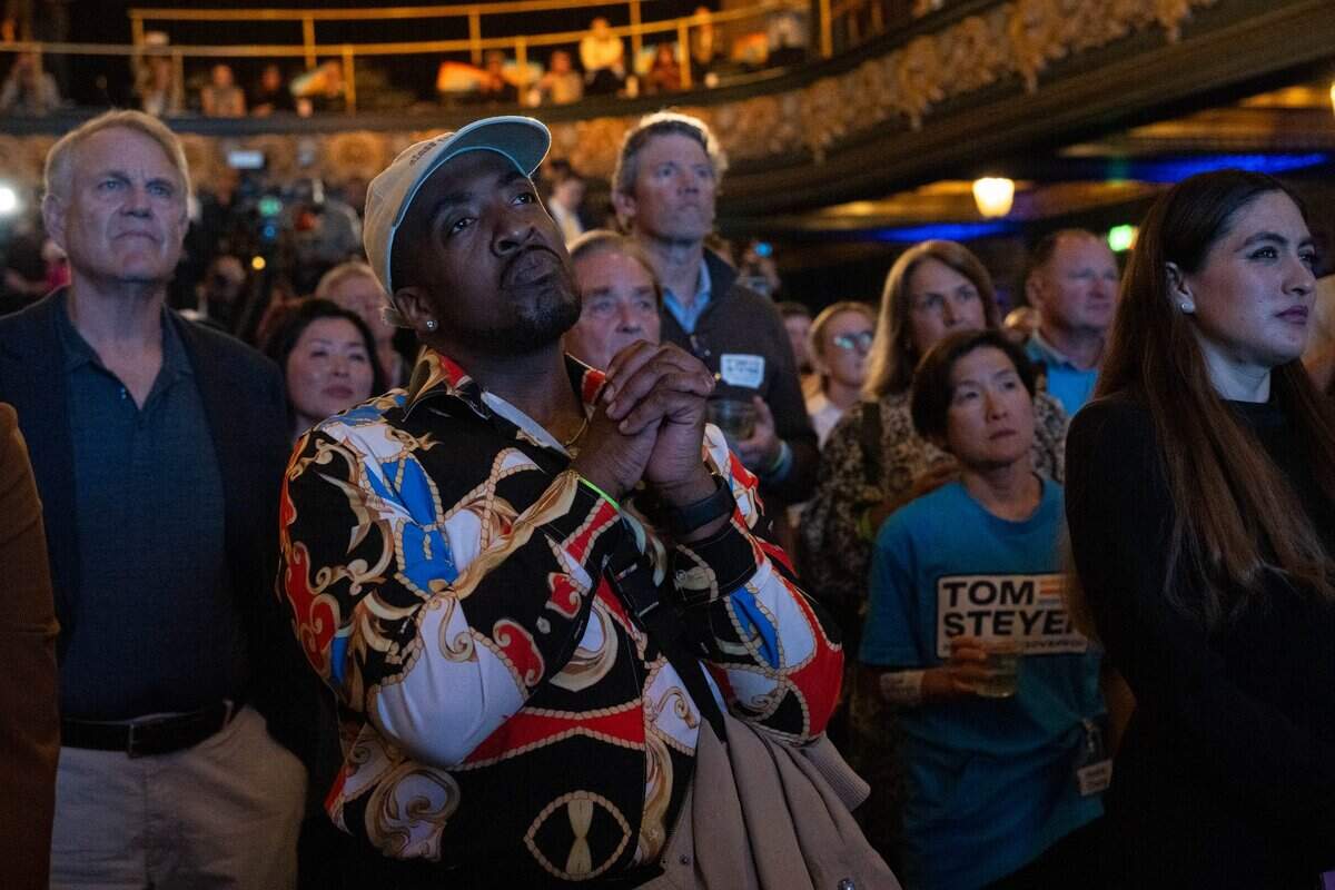 California gubernatorial candidate Tom Steyer’s supporters listen to his speech during an Election Night watch party on Tuesday at the Regency Ballroom in San Francisco. Steyer, a Democrat, was running in third place – a position that would not allow him to advance to the general election.