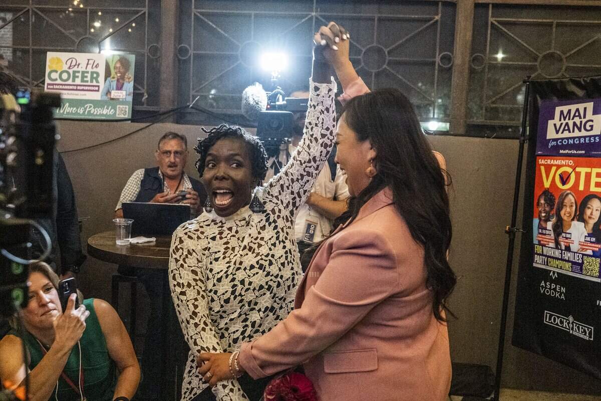 Sacramento Supervisor candidate Flojaune Cofer is celebrated by Sacramento City Councilmember Mai Vang, who is a candidate for the 7th Congressional District, during their election night party at The Lock & Key in midtown Sacramento on Tuesday.