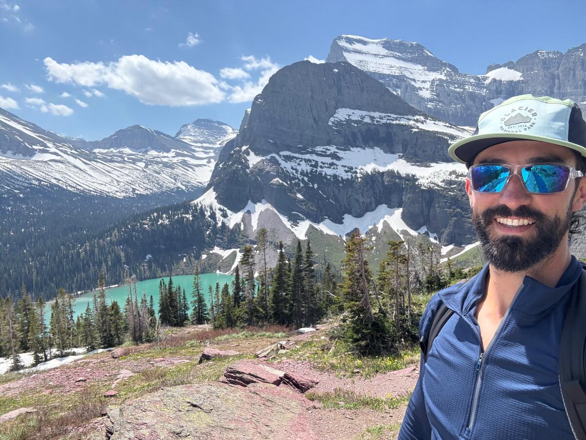 Daniel Crago smiles in a selfie Grinnell Glacier trail head just before a grizzly attack