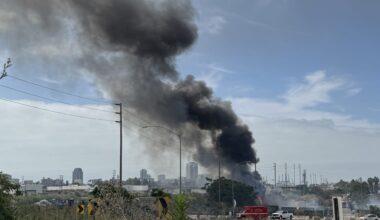 Large Trash Fire Near L.A. River Homeless Encampment Sends Smoke Across Long Beach