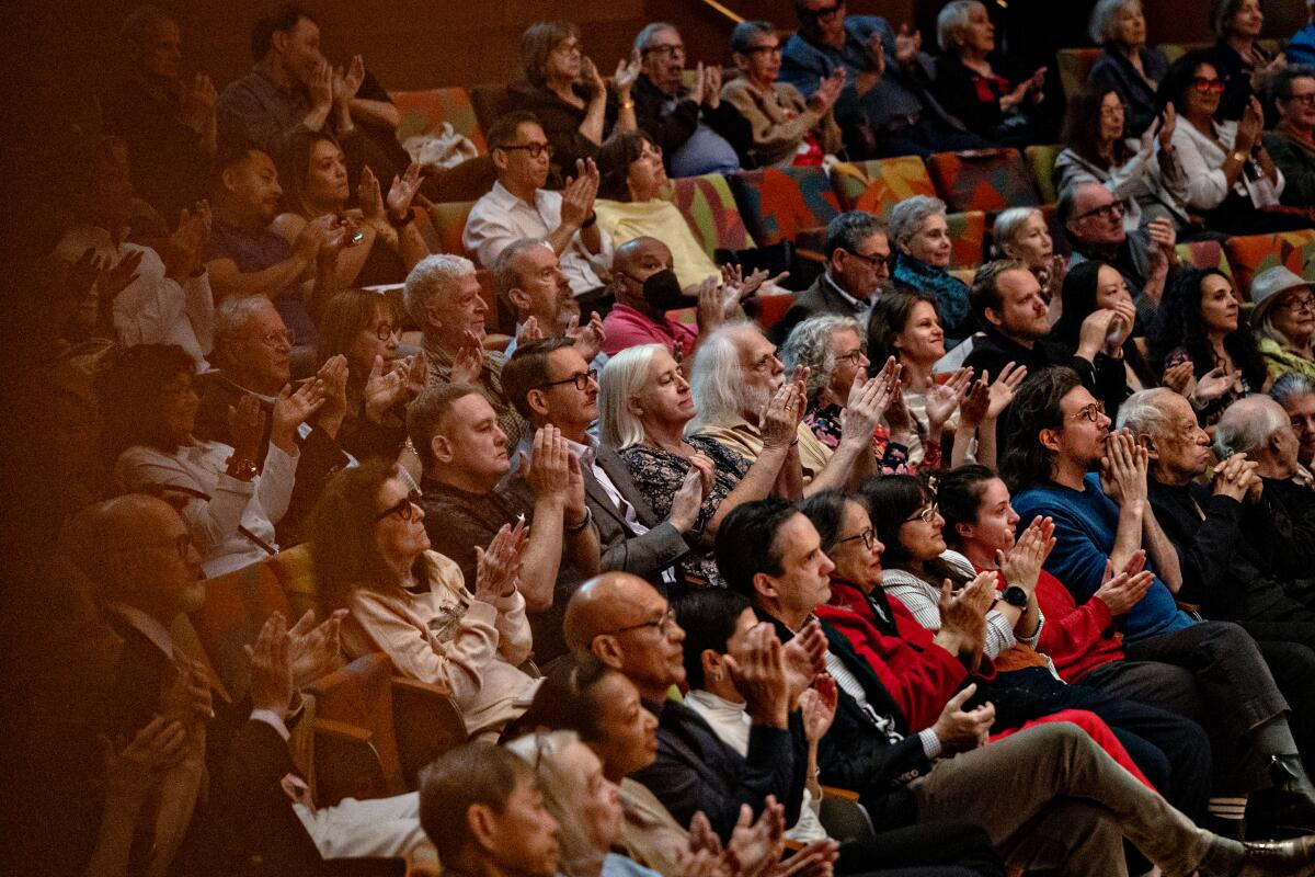 Patrons clap for Gustavo Dudamel as he conducts his final concert 