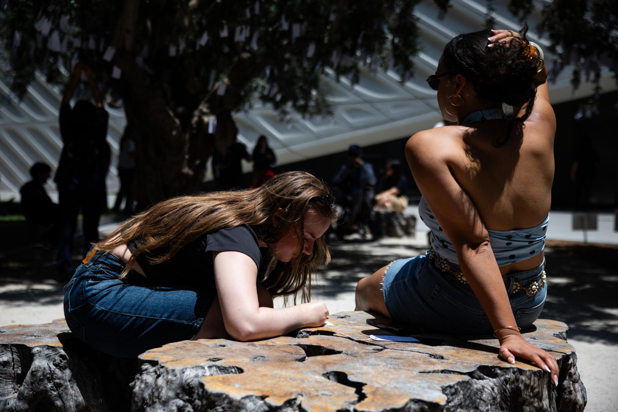 Sadie Whitman, 25, left, and Jaisa Pinnock, 25, from New York ready their wishes.