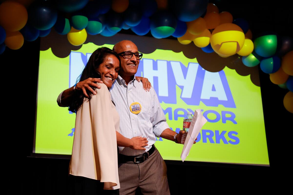 Los Angeles mayoral candidate Nithya Raman with her father Venkit Raman on election night.