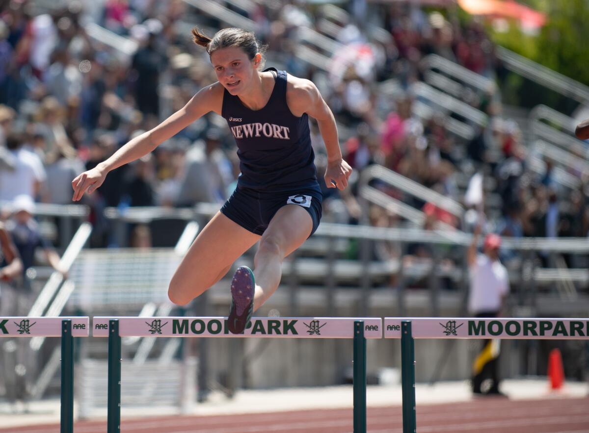 Newport Harbor's Natalie McCarty competes in the 300-meter hurdles.