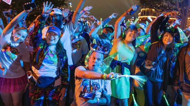 Thousands of pre-dawn walkers, including Daniel Bowen, center, stretch at the starting line of CHOC's annual 5k Walk in the Park in Anaheim on Sunday, Aug. 3, 2025. The event hosted more than 6,500 participants and raised over $2.3 million for children's health. (Photo by Mindy Schauer, Orange County Register/SCNG)