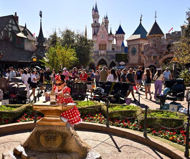 A visitors tries her luck at The Sword in the Stone at Fantasyland inside Disneyland at the Disneyland Resort Anaheim, CA, on Friday, January 16, 2026. (Photo by Jeff Gritchen, Orange County Register/SCNG)